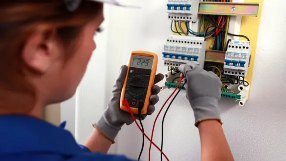 Electrician Testing Fuse Box