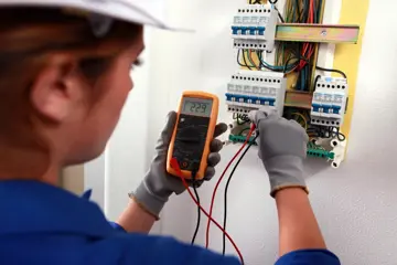 Electrician Testing Fuse Box