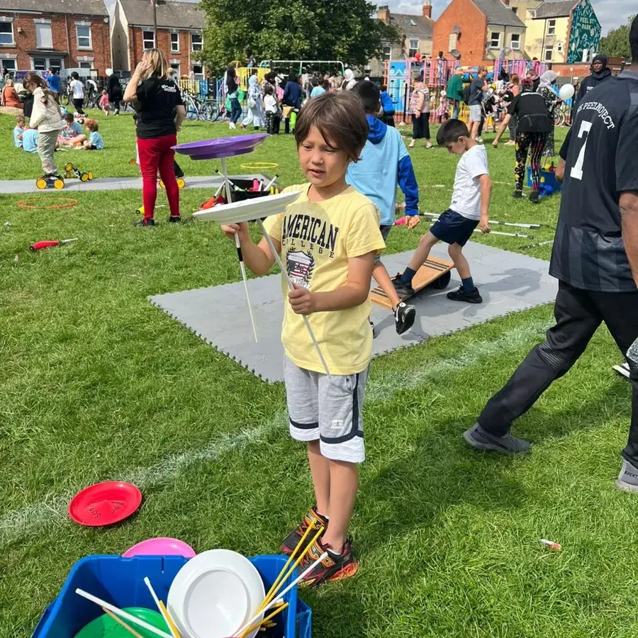 Boy Spins Plates At Peel Project Fun Day (1)