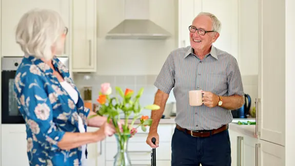 Older Man Talking To Woman In Kitchen