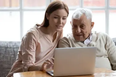 Man And Woman Using Laptop