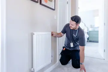 Man Fixing Radiator