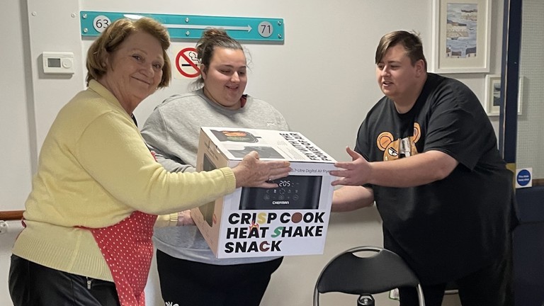Pfp Customer Support Co Odinator Pat Turley Handing Out Some Of The Air Fryers (1)